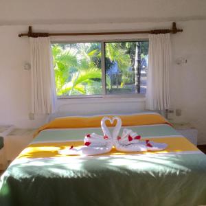 En eller flere senge i et værelse på Hotel Club Akumal Caribe