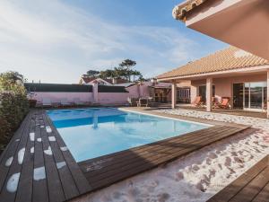 a swimming pool in the backyard of a house at BeSunny Slowness n' Outdoors in Esmoriz