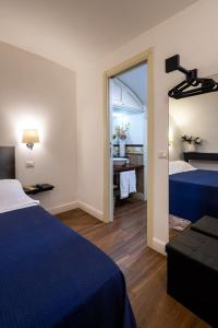 A bed or beds in a room at Le Piccole Lune di Monti