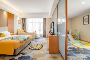 Postel nebo postele na pokoji v ubytování Zhangzhou Yuyuan Hotel