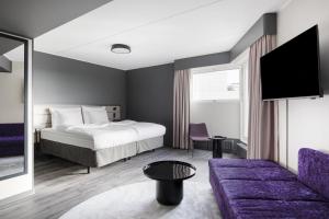 a hotel room with a bed and a couch at Original Sokos Hotel Vantaa in Vantaa