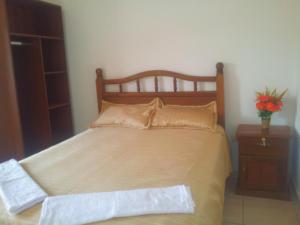 Ένα ή περισσότερα κρεβάτια σε δωμάτιο στο Residencial IKANDIRE ll