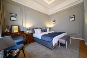 a hotel room with a bed and a chair at Hotel Transilvania in Cluj-Napoca +37 photos