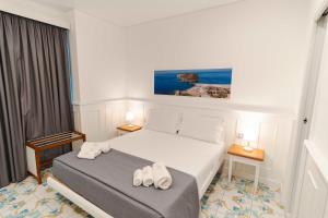 Cama ou camas em um quarto em TEA Luxury - Praia a Mare