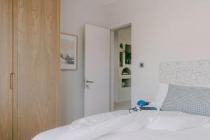 Postel nebo postele na pokoji v ubytování Tamarin Sunset Beach IV