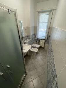 Koupelna v ubytování San Siro Guesthouse + 2 fotografie