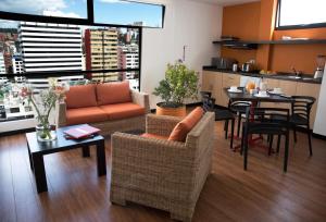 a living room with a couch and a table at Casa Q in Quito