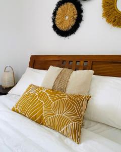 Postel nebo postele na pokoji v ubytování Palm Nest