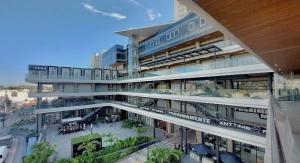 a large building with a street in front of it at Apartment In Camino Al Mar with Amazing View of the Ocean, Beach and Swimming Pool in Mazatlán