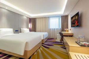 Postel nebo postele na pokoji v ubytování Lavande Hotel Beijing Tiananmen Square Wangfujing Street Branch