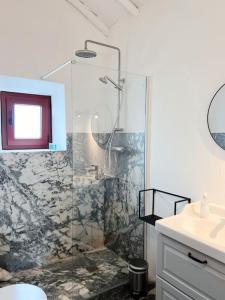 a bathroom with a shower and a sink at Monte de Santa Rita in Évora Monte +19 photos