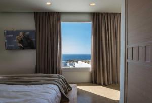 Andronis Arcadia Hotel客房内的一张或多张床位