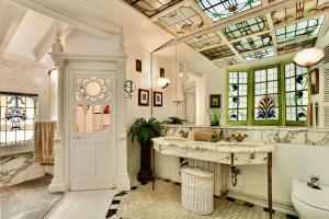a bathroom with a sink and a tub and a toilet at Mallorca One in Pollença +26 photos