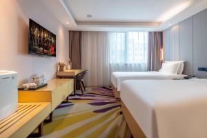 Postel nebo postele na pokoji v ubytování Lavande Hotel Beijing Tiananmen Square Wangfujing Street Branch