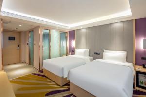 Postel nebo postele na pokoji v ubytování Lavande Hotel Beijing Tiananmen Square Wangfujing Street Branch
