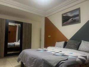 Ein Bett oder Betten in einem Zimmer der Unterkunft Appartement Familial Confortable