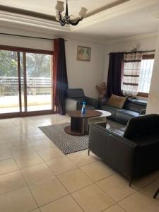 Ein Sitzbereich in der Unterkunft Appartement Familial Confortable
