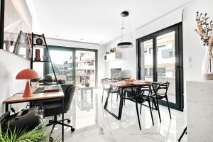 a dining room with a table and chairs at Casa Serena - Luxury Pool Apartment Villamartin, Costa Blanca in Alicante
