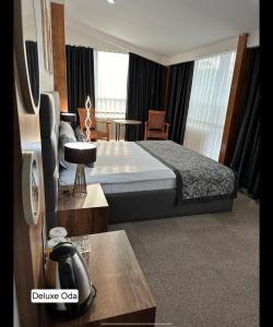 Postel nebo postele na pokoji v ubytování Grand Denizli Hotel