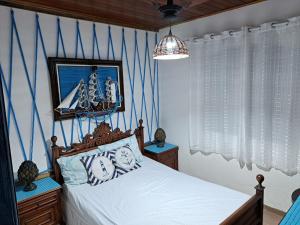Letto o letti in una camera di Casa Ilhabela entre a Praia Grande & Julião