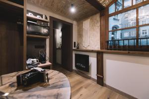a camera on a table in a room with a window at Photographer Rudolf's Studio - ground floor with separate entrance in Rīga