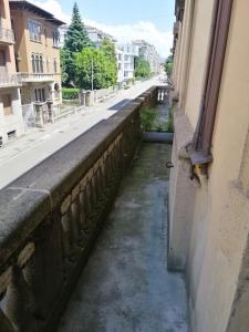 a canal of water between two buildings on a street at Appartamento Teatro Duse in Bergamo