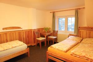 Postel nebo postele na pokoji v ubytování Hotel Sirákov