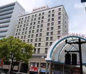 a tall building with a clock on it's side at Takamatsu Tokyu REI Hotel in Takamatsu
