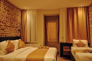 Ein Bett oder Betten in einem Zimmer der Unterkunft Galata Calm Tale Hotel