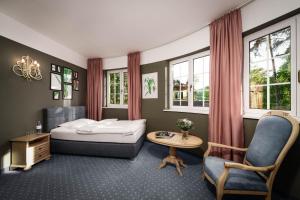 Postel nebo postele na pokoji v ubytování Hotel Villa Rainer