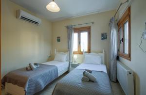 Ένα ή περισσότερα κρεβάτια σε δωμάτιο στο Aspro Apartments +140 φωτογραφίες