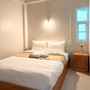 Postel nebo postele na pokoji v ubytování Yoi Hotel krabi