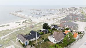an aerial view of a small town with a harbor at 1A, Stuga med 50m till strand in Byxelkrok