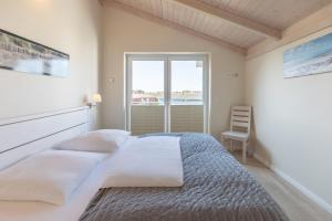 Ένα ή περισσότερα κρεβάτια σε δωμάτιο στο Meeresbrise