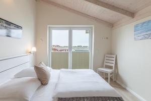 Ένα ή περισσότερα κρεβάτια σε δωμάτιο στο Nordseeluft