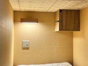 Postel nebo postele na pokoji v ubytování Backpackers Hida Takayama