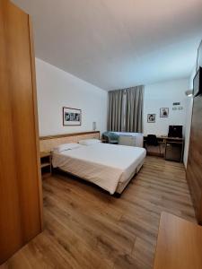 Postel nebo postele na pokoji v ubytování Hotel Tre Ville