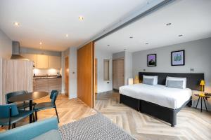 a hotel room with a bed and a kitchen at Staycity Aparthotels Edinburgh West End in Edinburgh