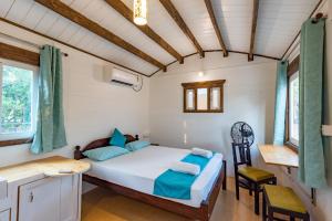 Ένα ή περισσότερα κρεβάτια σε δωμάτιο στο Palmeiral -BeachCottages +17 φωτογραφίες