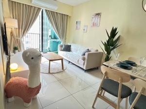 a living room with a couch and a table at Muji Haus near Sunway City #2Bedroom #Netflix in Subang Jaya