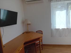 TV o dispositivi per l'intrattenimento presso Liget Üdülőpark Fonyód