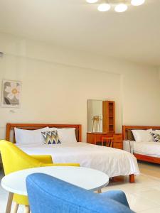 Postel nebo postele na pokoji v ubytování Apple Homestay