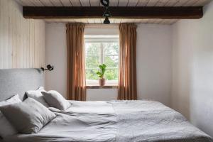 En eller flere senge i et værelse på Rubensholm Bed & Breakfast