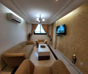 TV a/nebo společenská místnost v ubytování Residence Le Carat