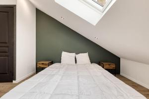 Postel nebo postele na pokoji v ubytování Le Duplex