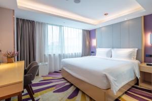 Postel nebo postele na pokoji v ubytování Lavande Hotel Beijing Tiananmen Square Wangfujing Street Branch