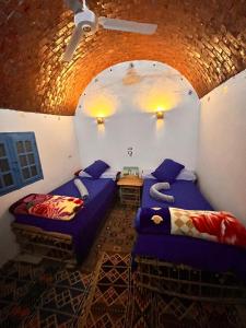 Postel nebo postele na pokoji v ubytování Wesy Ka Guest House