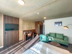 a living room with a couch and a table at DX Apartments in Berlin