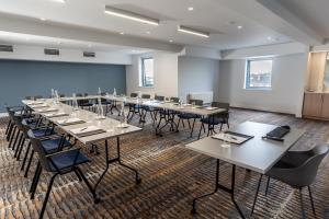 a large conference room with tables and chairs at Great National South Court Hotel in Limerick