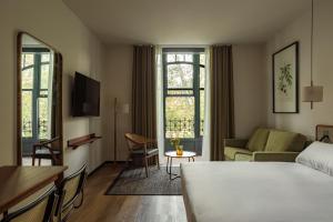 Postel nebo postele na pokoji v ubytování Batimont Suites & Apartments